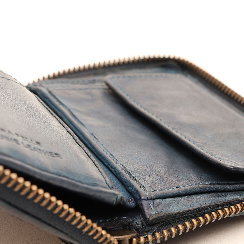 Kleine Damenbrieftasche mit umlaufendem Reißverschluss aus gewebtem, jeansfarbenem Leder von Gianni Conti