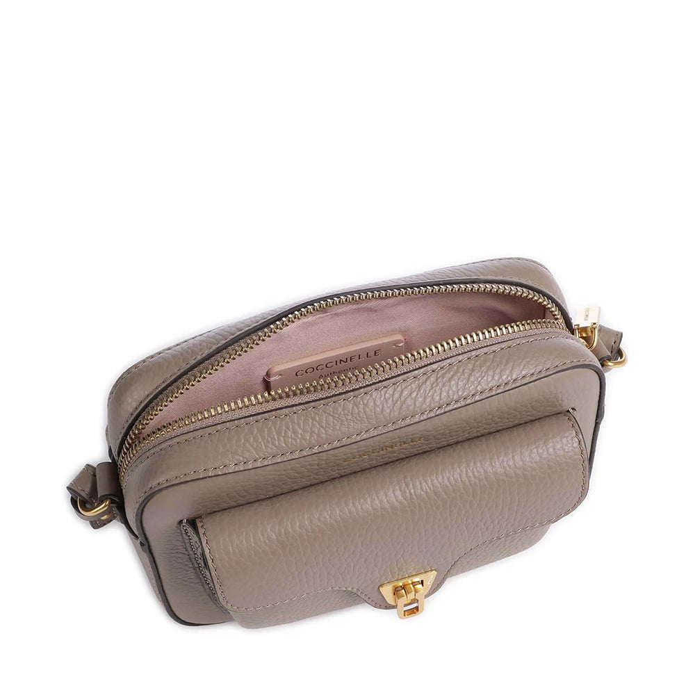 COCCINELLE Beat Soft Mini Linie
Damen Umhängetasche aus warmem Taupe-Leder