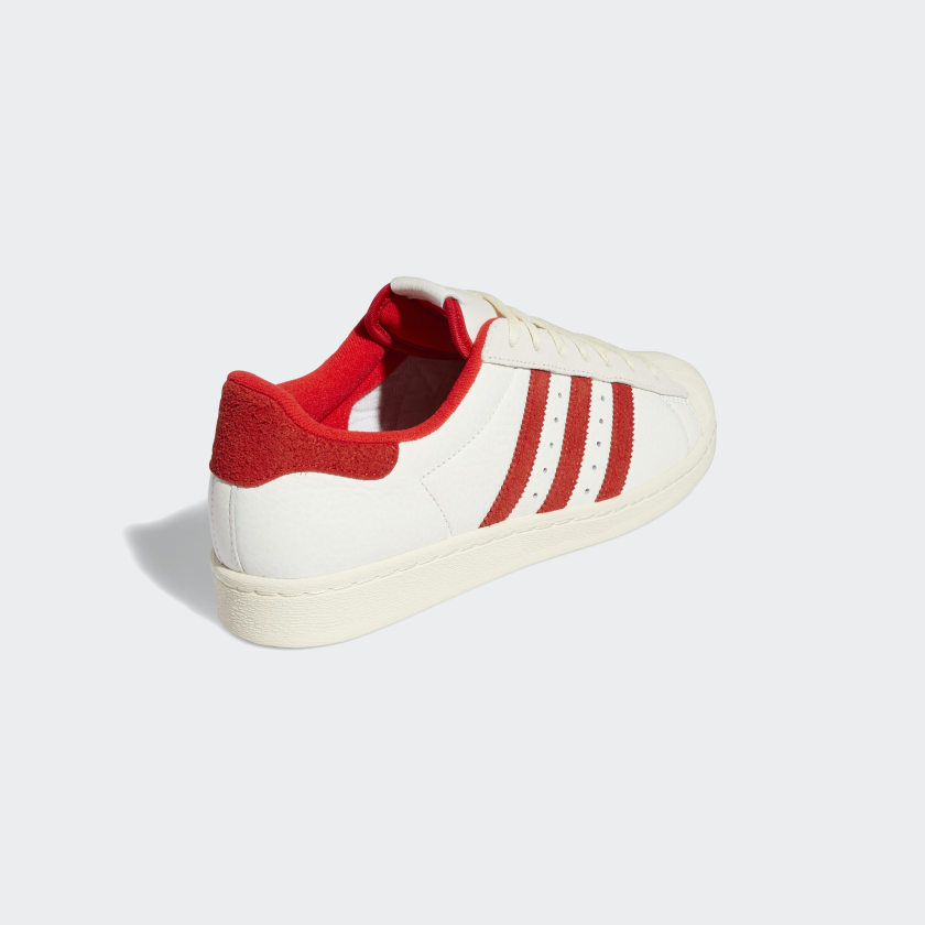 Scarpe ADIDAS Sneakers Uomo linea Superstar 82 in Pelle colore Bianco e Rosso